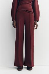 INTERLOCK KNIT TROUSERS WITH VENTS