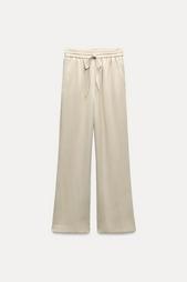 CREASED-EFFECT WIDE-LEG TROUSERS