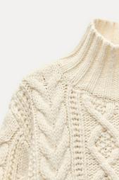 CABLE-KNIT SWEATER